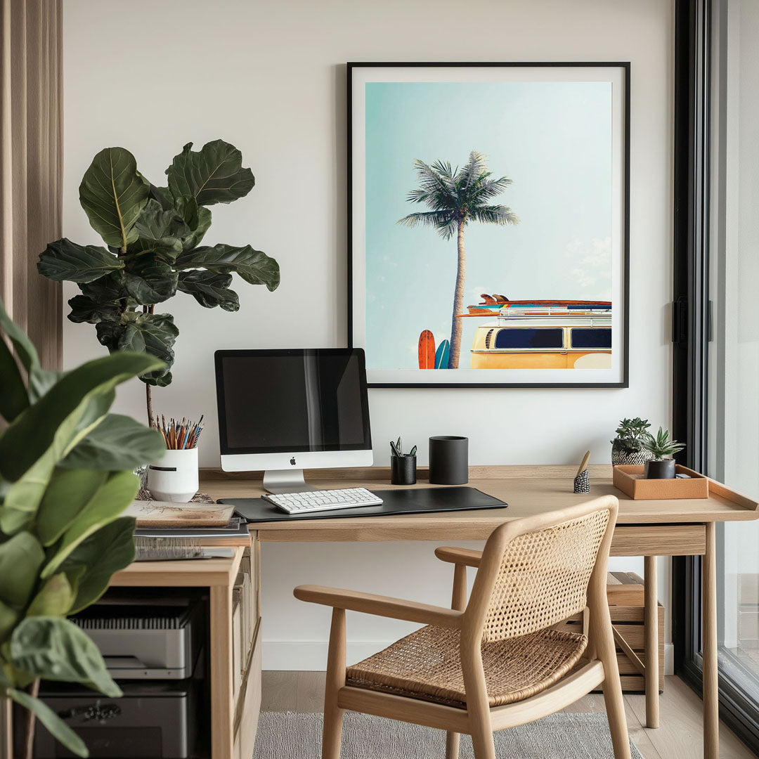 Modern office interior with a coastal wall art print featuring soft blue waves and sandy hues, adding a calming, beach-inspired atmosphere to the workspace.