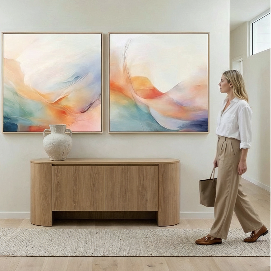 Woman walking in a modern home interior with abstract art on the wall.